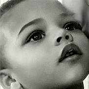 Desyrai is registered to the contest to win money with this photo: child, portrait, black_and_white, face, curly_hair, looking_up, innocence, close_up, soft_light, expression, young_child, monochrome, curtain, young_face, innocent, candid, childhood, thoughtful, profile, emotion