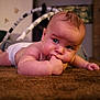 Maliki is registered to the contest to win money with this photo: baby, infant, carpet, indoor, child, diaper, skin, hand, face, crawling, floor, cute, young, person, expression, room, furniture, blanket, soft, curious