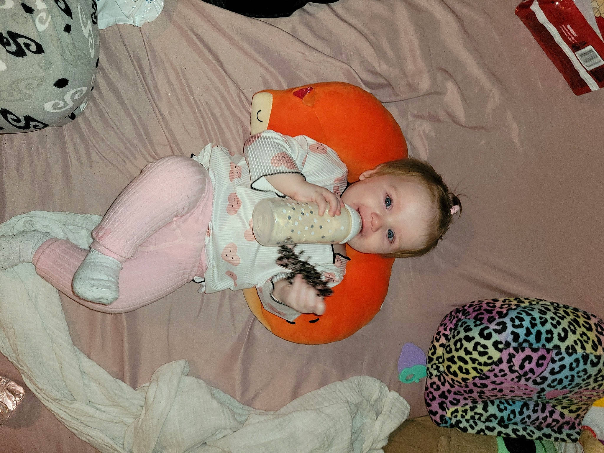 Jaylynn is registered to the contest to win money with this photo: baby, baby_products, baby_sleeping, baby_toddler_clothing, baby_toys, cheek, child, comfort, human_body, linens, orange, pattern, person, pink, product, room, textile, toddler