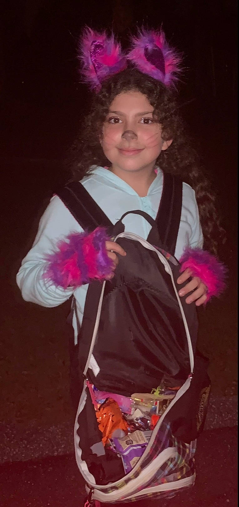 Khloe joined the competition — help win amazing prizes! bag, child, costume, costume_design, entertainment, event, fashion_accessory, fashion_design, formal_wear, fun, hairstyle, joy, magenta, person, pink, purple, sleeve, smile, tradition, violet