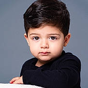 Lucas joined the competition — help win amazing prizes! child, toddler, portrait, face, brown_eyes, dark_hair, black_sweater, resting, cozy, indoor, closeup, cute, young, expression, soft_lighting, studio, innocent, looking_at_camera, neutral_expression, background