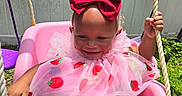 Haislyn joined the competition — help win amazing prizes! toddler, child, swing, pink, dress, strawberry, bow, outdoor, sunlight, grass, rope, playground, happy, smile, seat, person, baby, cute, fun, summer