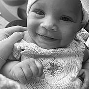 Haislyn is registered to the contest to win money with this photo: baby, black_and_white, child, closeup, clothing, cute, face, hand, happy, headwrap, infant, knitwear, person, portrait, smile, soft, support, texture, warmth, young