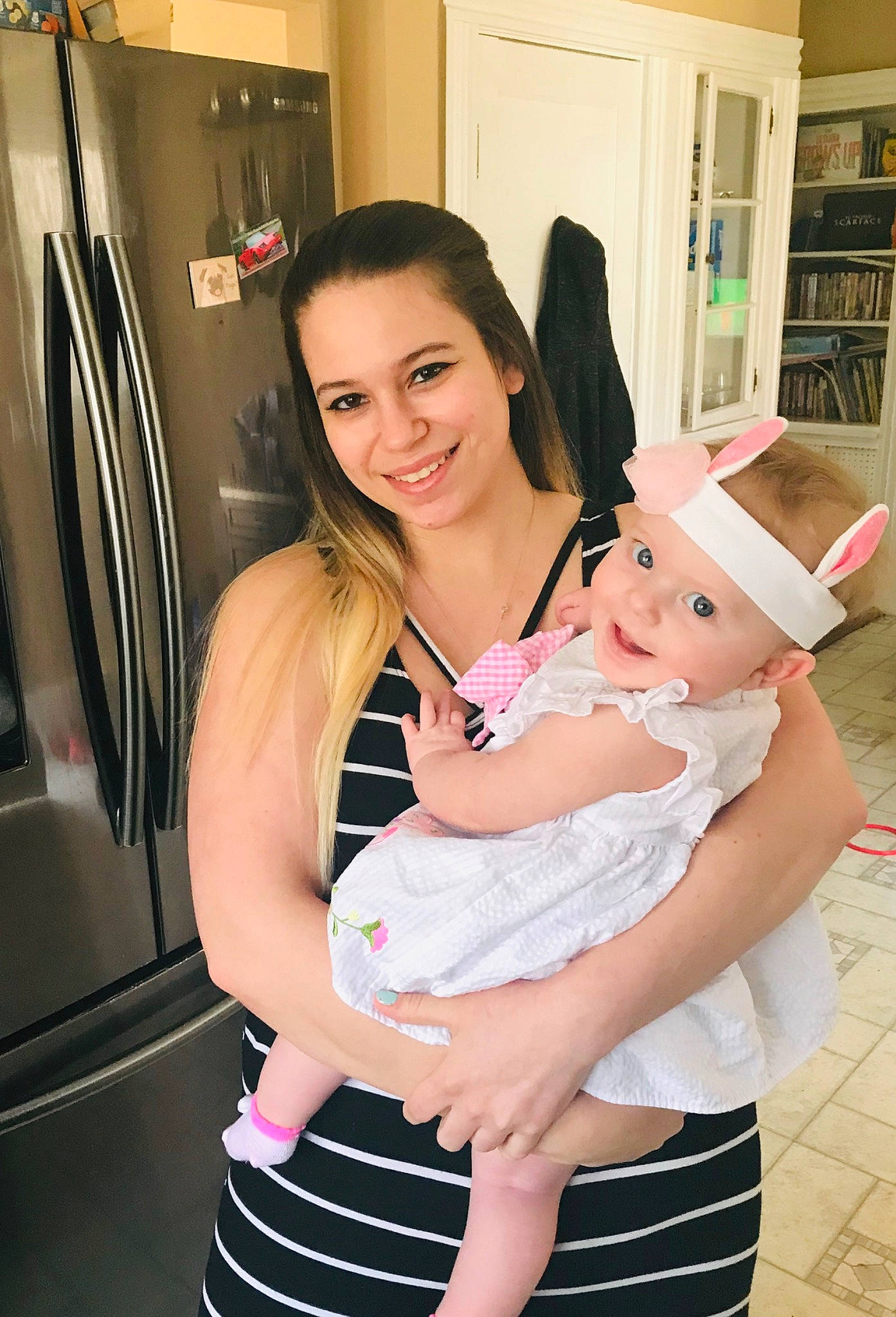 Lilyanna is registered to the contest to win money with this photo: abdomen, arm, baby, black_hair, child, finger, hand, happy, headwear, human_body, joint, joy, leg, long_hair, mouth, neck, person, pink, product, shoulder