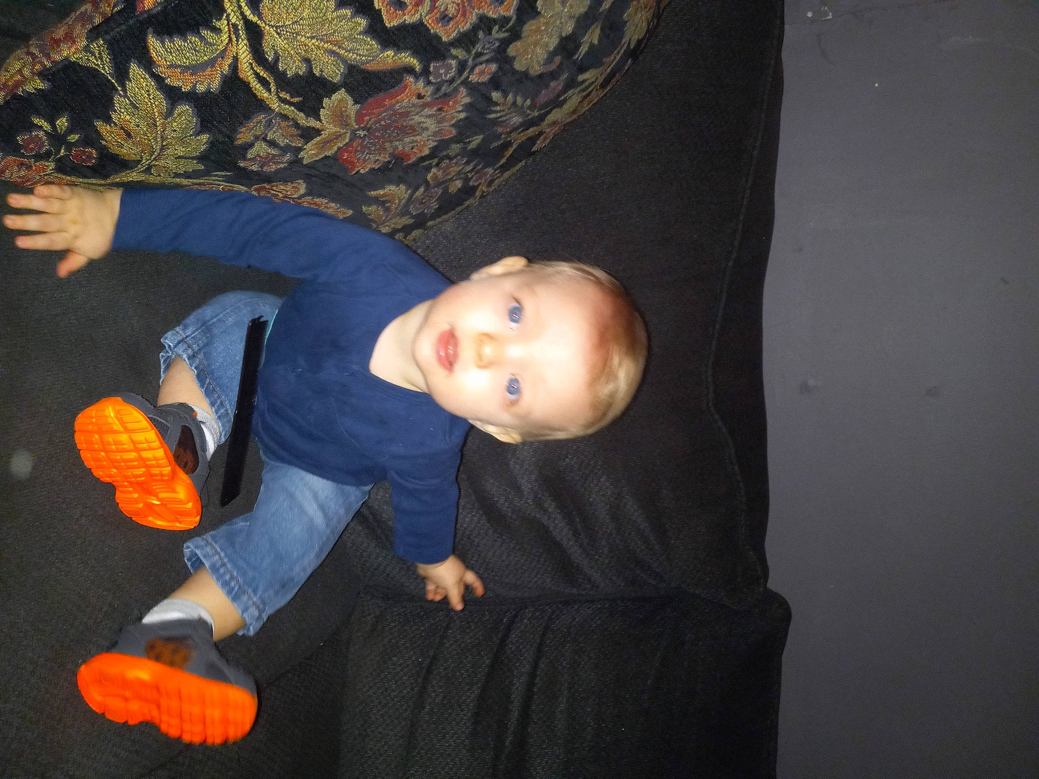 Skylar is registered to the contest to win money with this photo: baby, baby_products, baby_toddler_clothing, baby_toys, cheek, child, comfort, darkness, eye, flash_photography, flooring, fun, linens, person, room, sitting, thumb, toddler, toy, wood