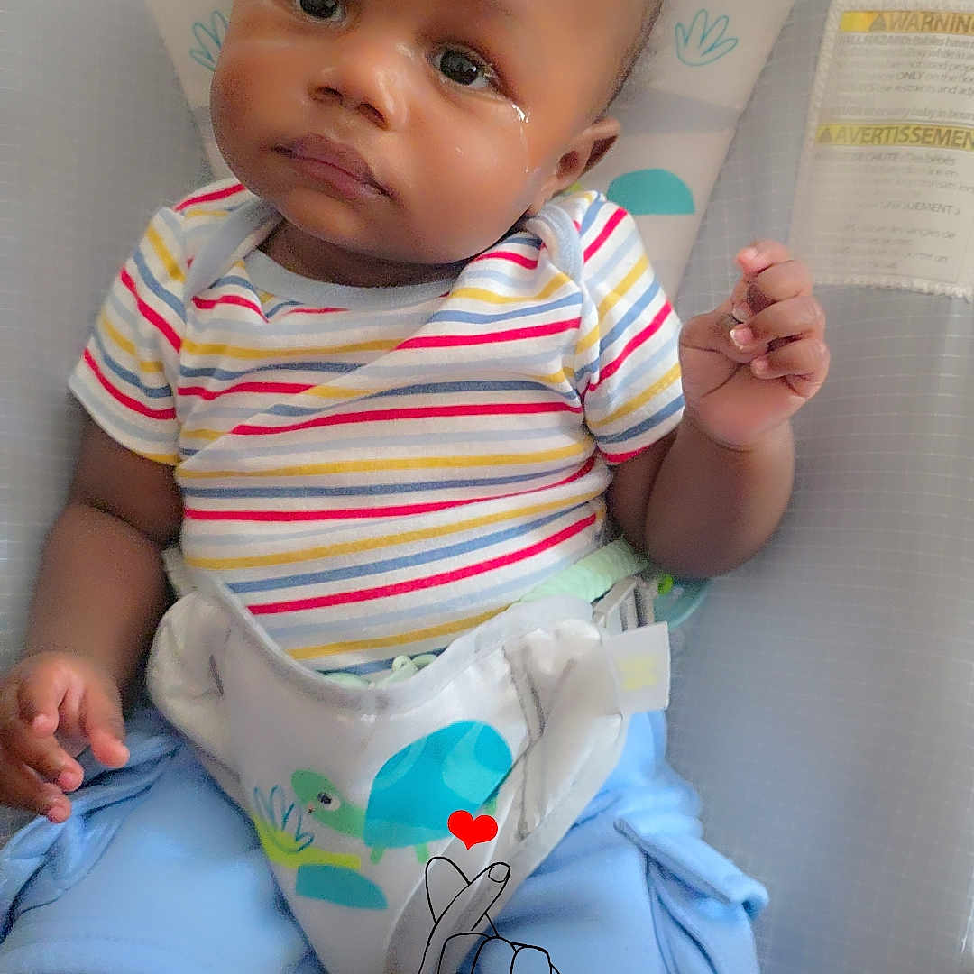 Kavion Cooper joined the competition — help win amazing prizes! baby, child, infant, striped_shirt, blue_shorts, baby_seat, tear, doodle, hand_drawing, heart, toy, monkey_design, sun_design, cute, expression, indoor, seated, person, clothing, colorful