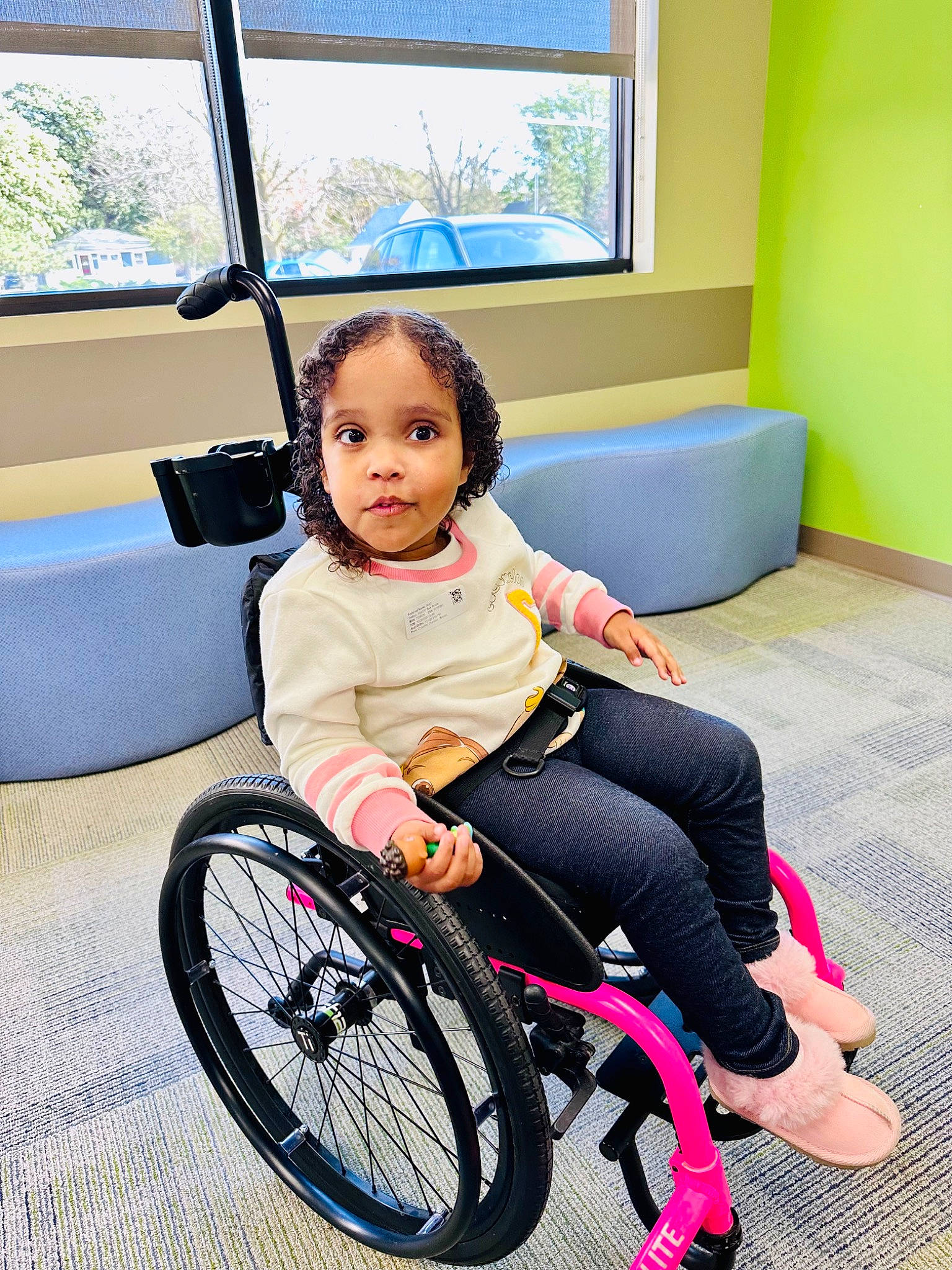 Wyatt is registered to the contest to win money with this photo: automotive_tire, bicycle_tire, bicycle_wheel, chair, child, comfort, dress, fun, furniture, happy, knee, leg, leisure, person, rim, sneakers, tire, toddler, wheel, wheelchair