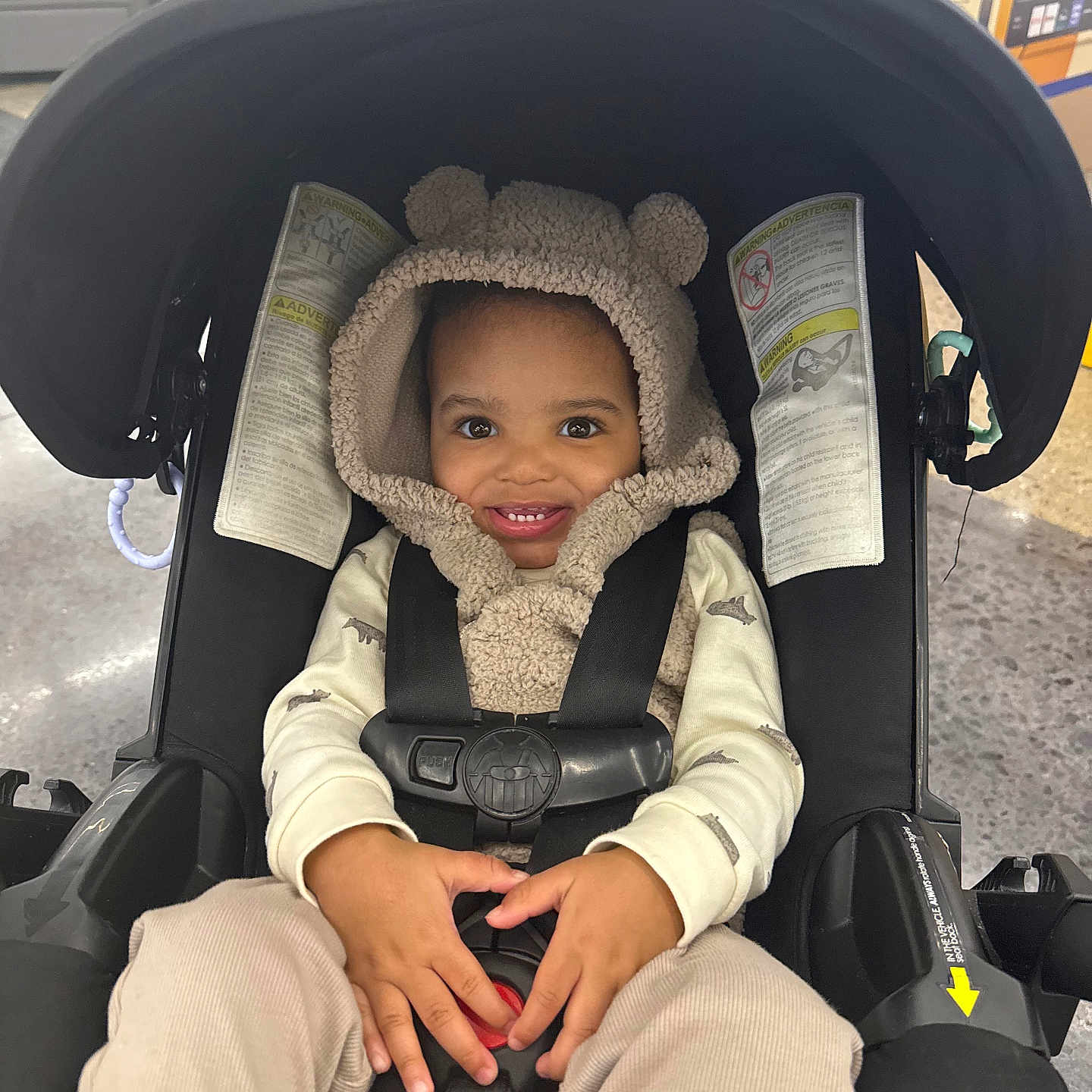 Psalm joined the competition — help win amazing prizes! toddler, child, car_seat, hoodie, smiling, baby, indoor, clothing, seatbelt, cute, happy, person, face, hands, pants, toy, store, background, baby_carrier, cozy