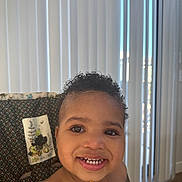 Psalm joined the competition — help win amazing prizes! toddler, child, smiling, curly_hair, high_chair, indoor, face, happy, baby_food, teeth, patterned_fabric, window_blinds, person, cute, young_child, skin, portrait, seat, tableware, natural_light