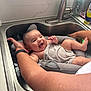 baby, infant, smile, bath, sink, kitchen, towel, water, arm, adult, support, happy, cute, indoors, person, skin, expression, care, cleaning, family