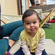 Sirelle participe au concours pour gagner de l'argent avec cette photo : baby, brick_wall, casual, child, curious, cushion, cute, face, hammock, happy, infant, outdoor, person, playful, portrait, sitting, smile, socks, tongue_out, yellow_shirt