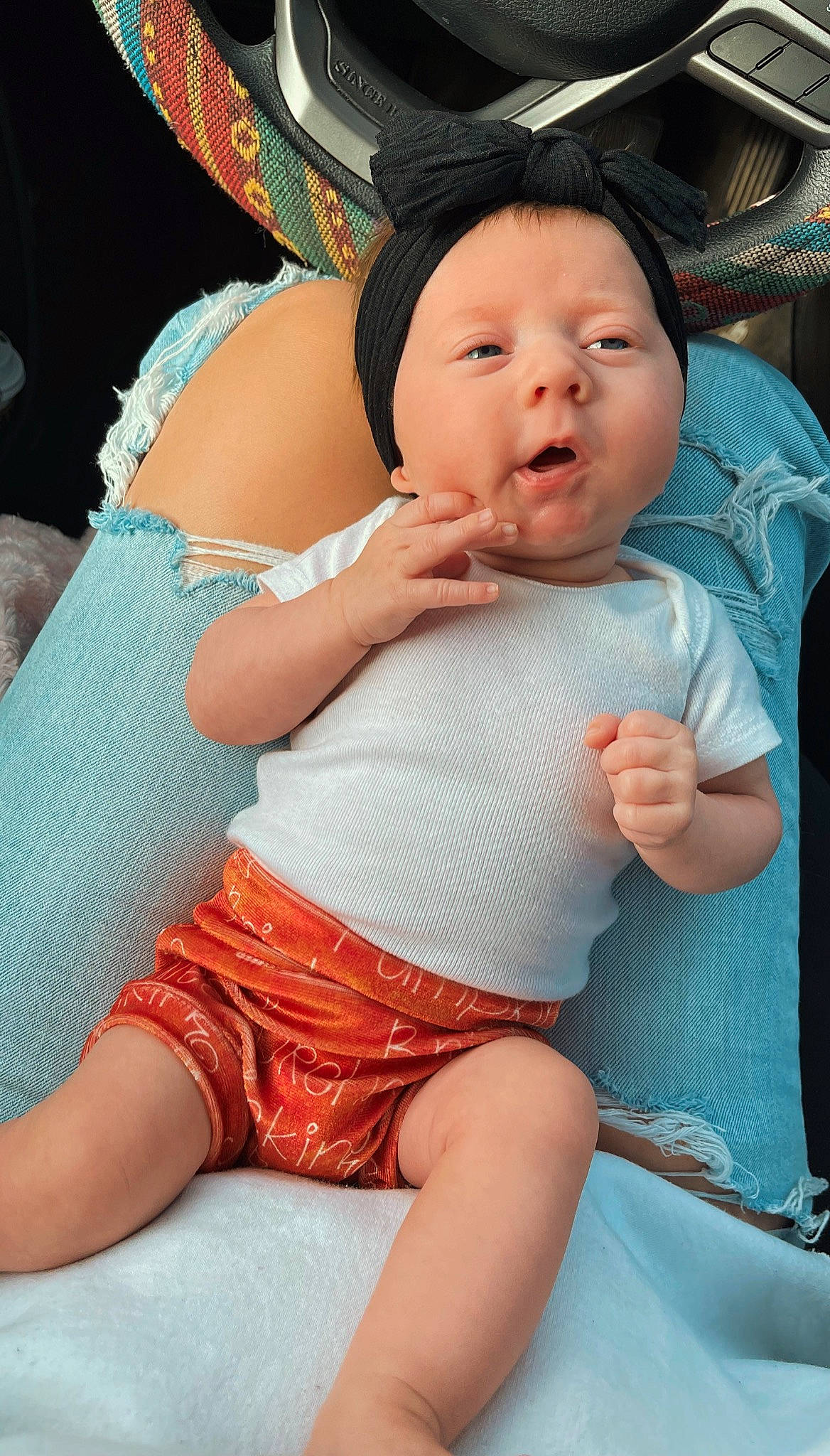 Kodee is registered to the contest to win money with this photo: abdomen, baby, black_hair, chest, child, comfort, eye, finger, hairstyle, happy, headwear, human_body, leg, mouth, person, pink, skin, stomach, sun_hat, thigh