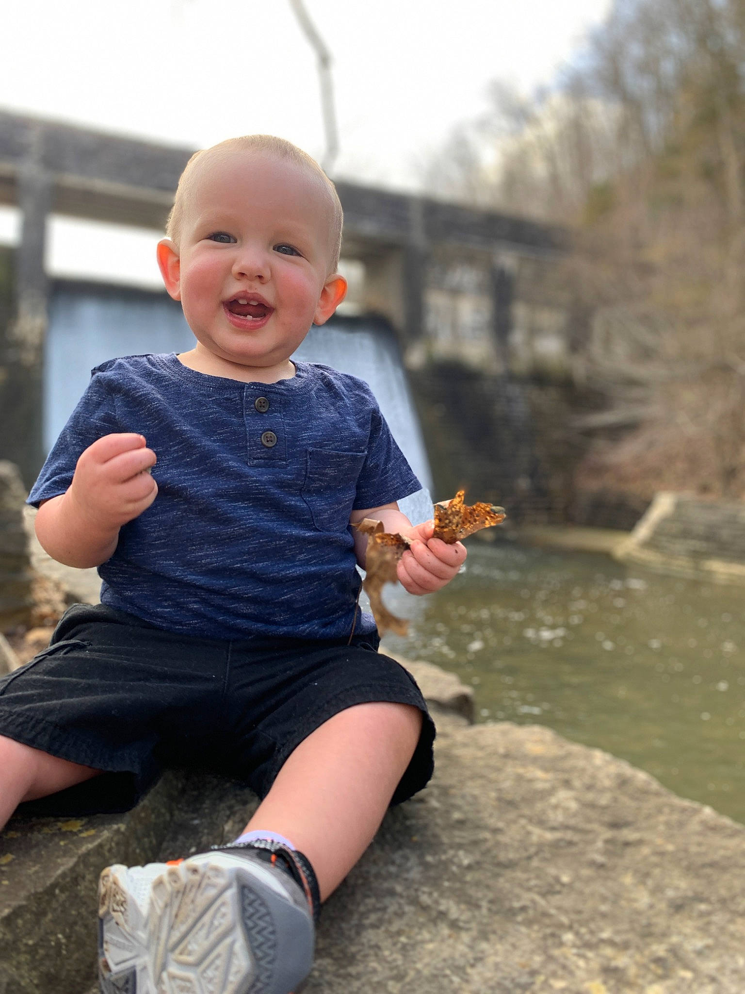 Cooper joined the competition — help win amazing prizes! baby, baby_toddler_clothing, flash_photography, fun, grass, happy, human_leg, knee, lake, leisure, person, shorts, sitting, sky, sleeve, smile, sock, t_shirt, thigh, toddler
