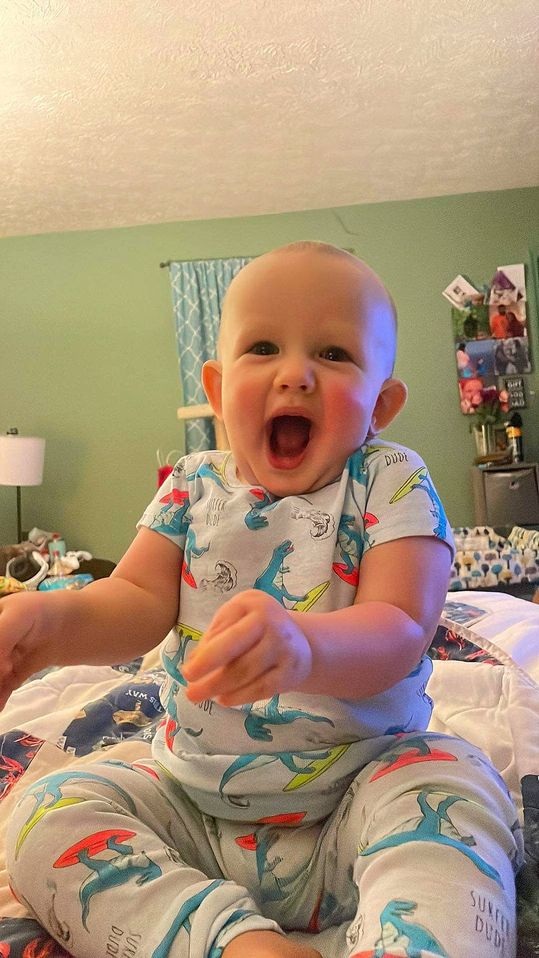 Cooper is registered to the contest to win money with this photo: baby, baby_laughing, baby_products, baby_toddler_clothing, cheek, child, comfort, eye, fun, happy, knee, mouth, person, play, room, sitting, skin, smile, t_shirt, thigh