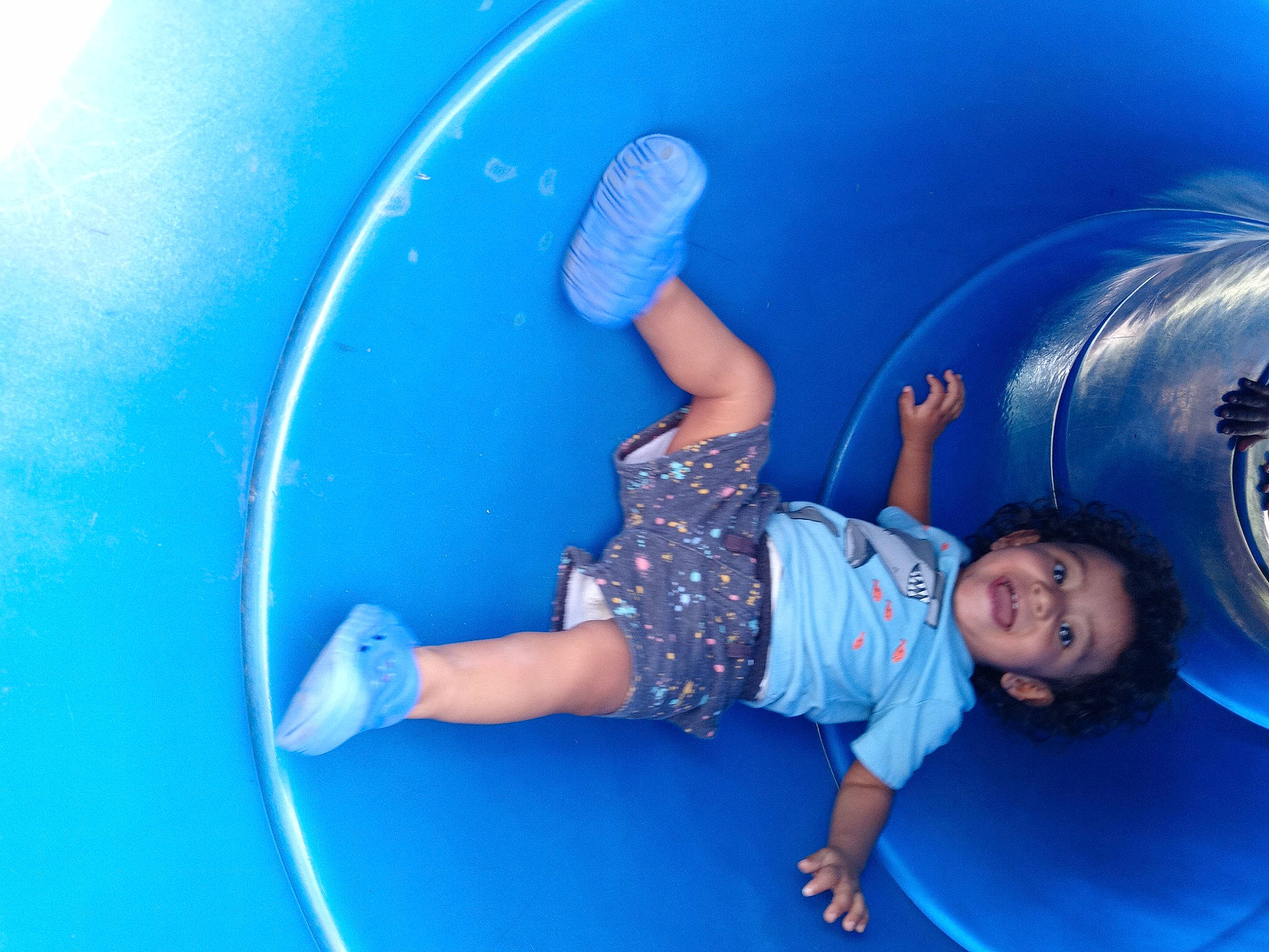 Alistar is registered to the contest to win money with this photo: aqua, azure, blue, child, circle, elbow, electric_blue, flash_photography, fun, happy, hood, inflatable, leisure, outdoor_play_equipment, person, physical_fitness, playground, recreation, shorts, t_shirt