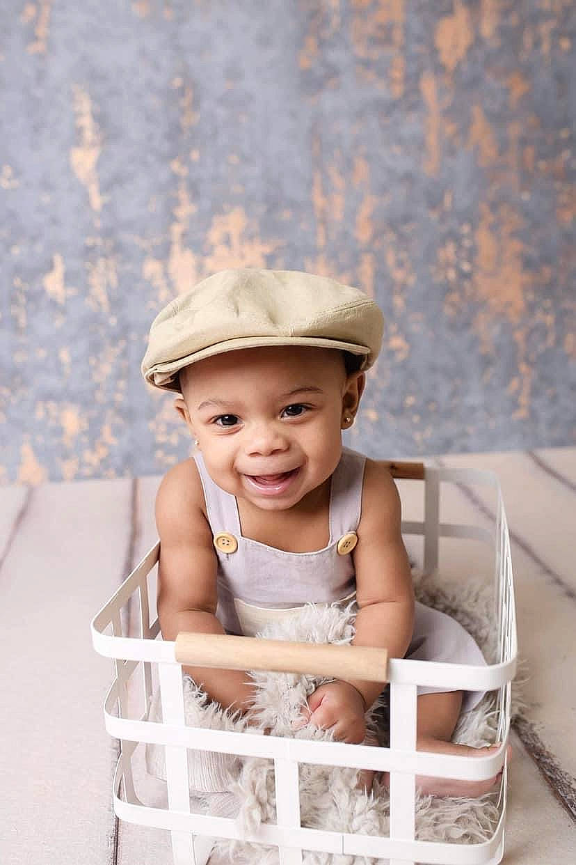 Kyree joined the competition — help win amazing prizes! baby, baby_safety, baby_toddler_clothing, cap, chair, child, fashion_accessory, flash_photography, fun, happy, hat, headgear, headwear, joy, leisure, person, photograph, product, sitting, smile