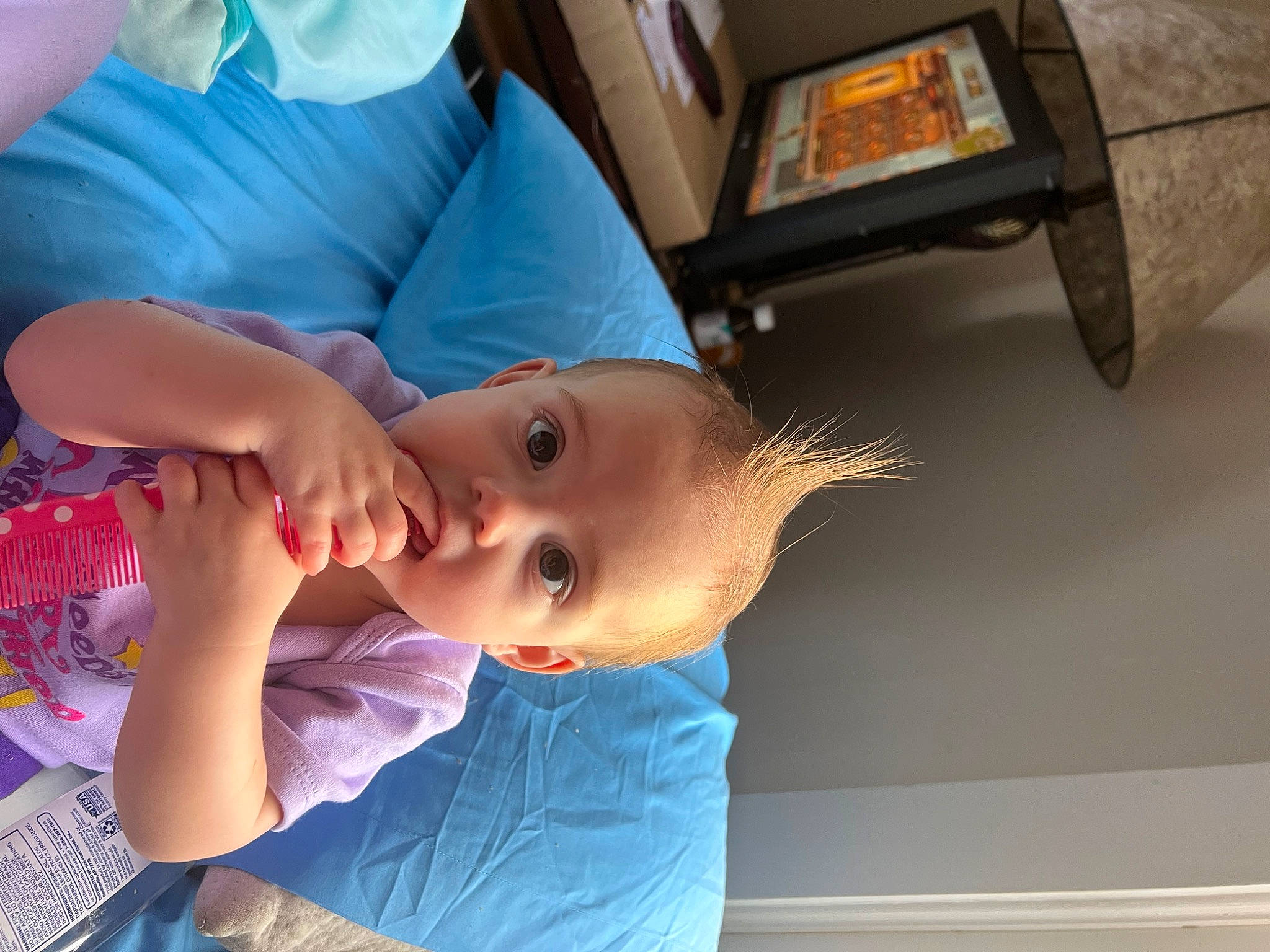 Angel is registered to the contest to win money with this photo: baby, baby_toddler_clothing, box, child, ear, electric_blue, fun, hairstyle, person, room, skin, toddler, vacation