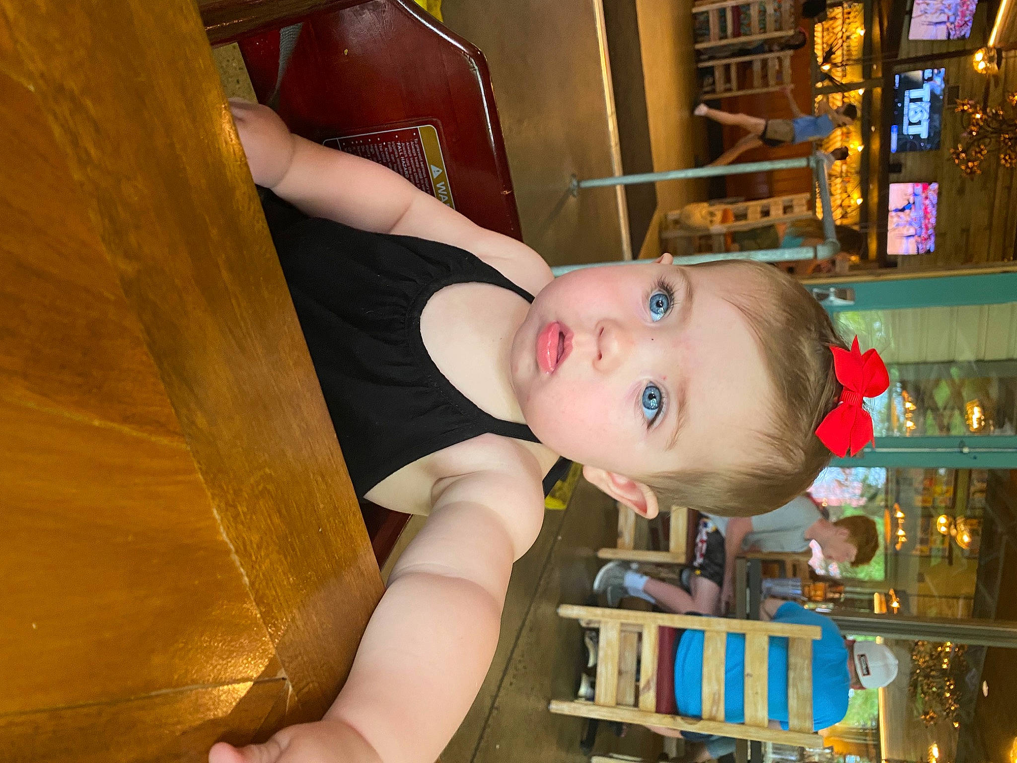Camryn joined the competition — help win amazing prizes! baby, chair, cheek, child, fun, happy, human_body, iris, leisure, nose, person, picture_frame, room, shelf, shelving, sitting, smile, toddler, wood
