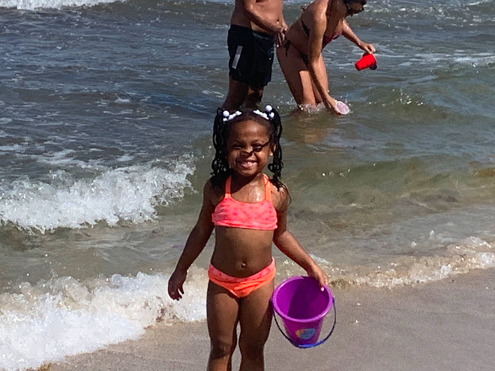 Nevaeh is registered to the contest to win money with this photo: bathing, beach, bikini, child, fun, happy, joy, muscle, people_on_beach, person, photobombing, photography, play, recreation, sea, smile, spring_break, summer, swimwear, undergarment