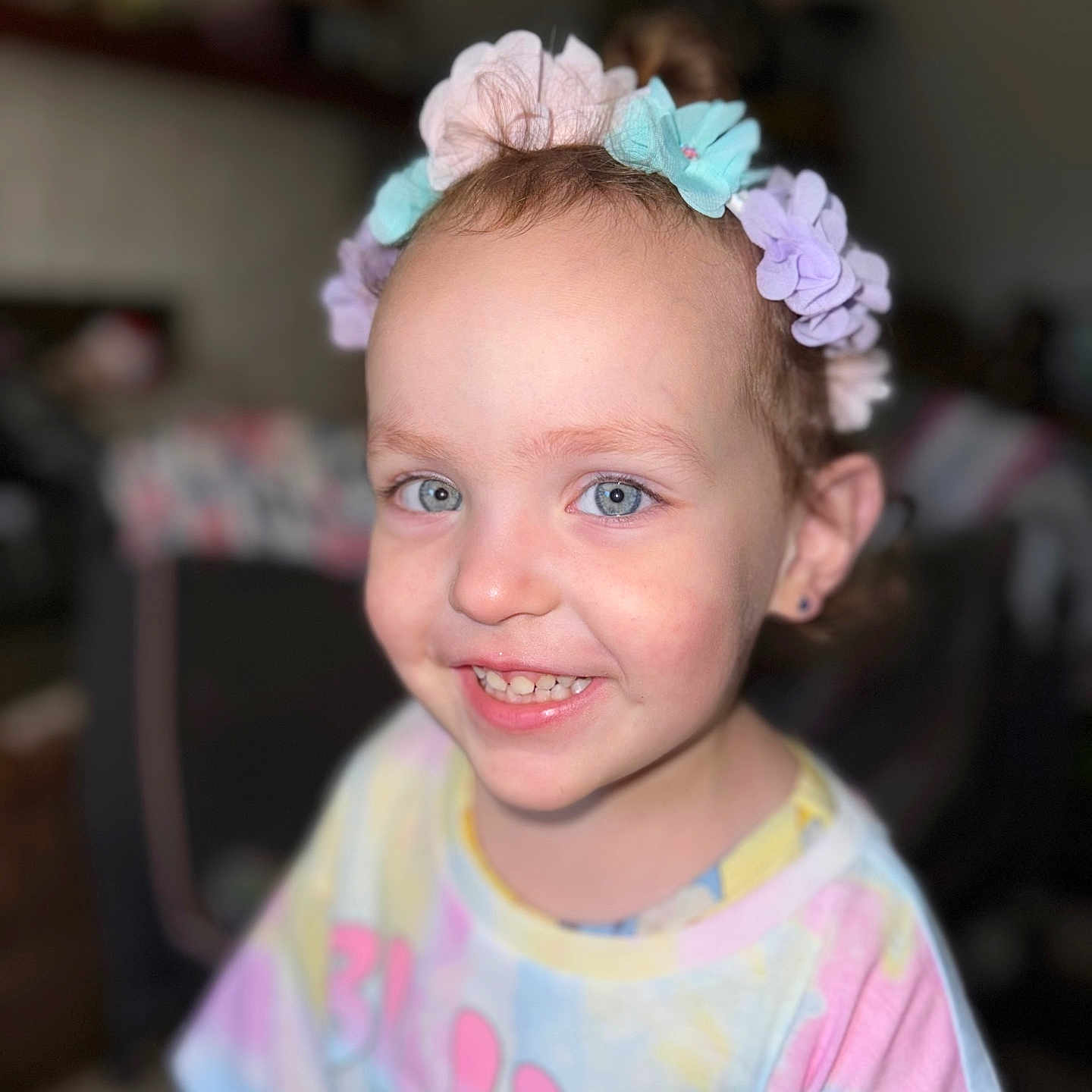 Athena is registered to the contest to win money with this photo: accessories, baby, clothing, computerhardware, dress, electronics, face, happy, hardware, head, headband, jewelry, monitor, person, photography, portrait, screen, smile, t_shirt, tv