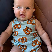 Hudson joined the competition — help win amazing prizes! baby, infant, child, blue_eyes, pretzel_pattern, clothing, sitting, portrait, cute, skin, face, arm, leg, seat, fabric, texture, indoor, person, expression, young