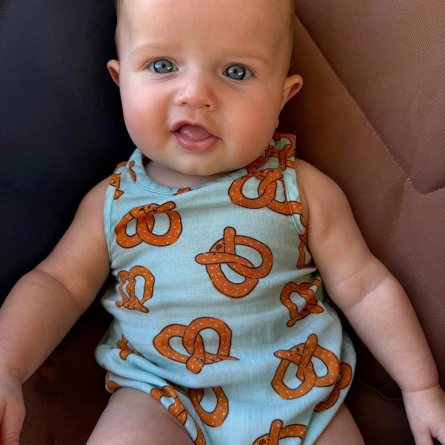 Hudson joined the competition — help win amazing prizes! baby, infant, child, blue_eyes, pretzel_pattern, clothing, sitting, portrait, cute, skin, face, arm, leg, seat, fabric, texture, indoor, person, expression, young