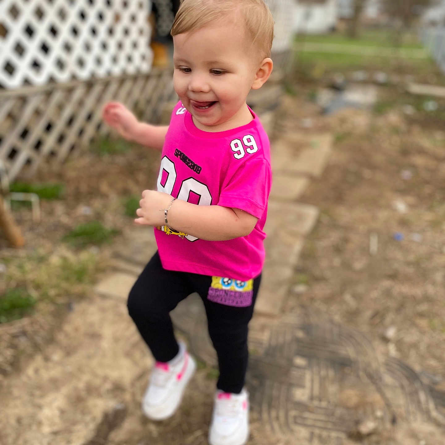 Raelynne is registered to the contest to win money with this photo: backyard, ball, clothing, face, football, footwear, grass, head, nature, outdoors, pants, person, photography, portrait, shoe, soccer, soccerball, soil, sport, yard