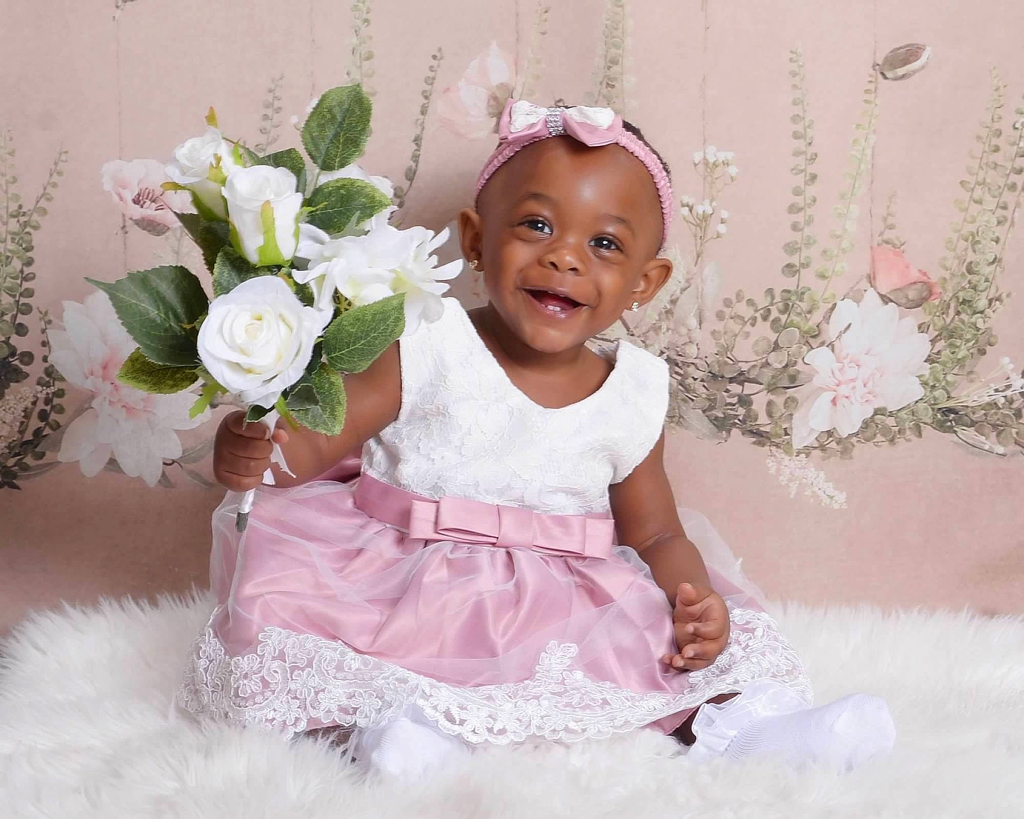 Xahnea is registered to the contest to win money with this photo: baby, baby_toddler_clothing, beauty, child, dress, face, flash_photography, flower, happy, headgear, joy, magenta, person, petal, pink, plant, product, sleeve, smile, textile