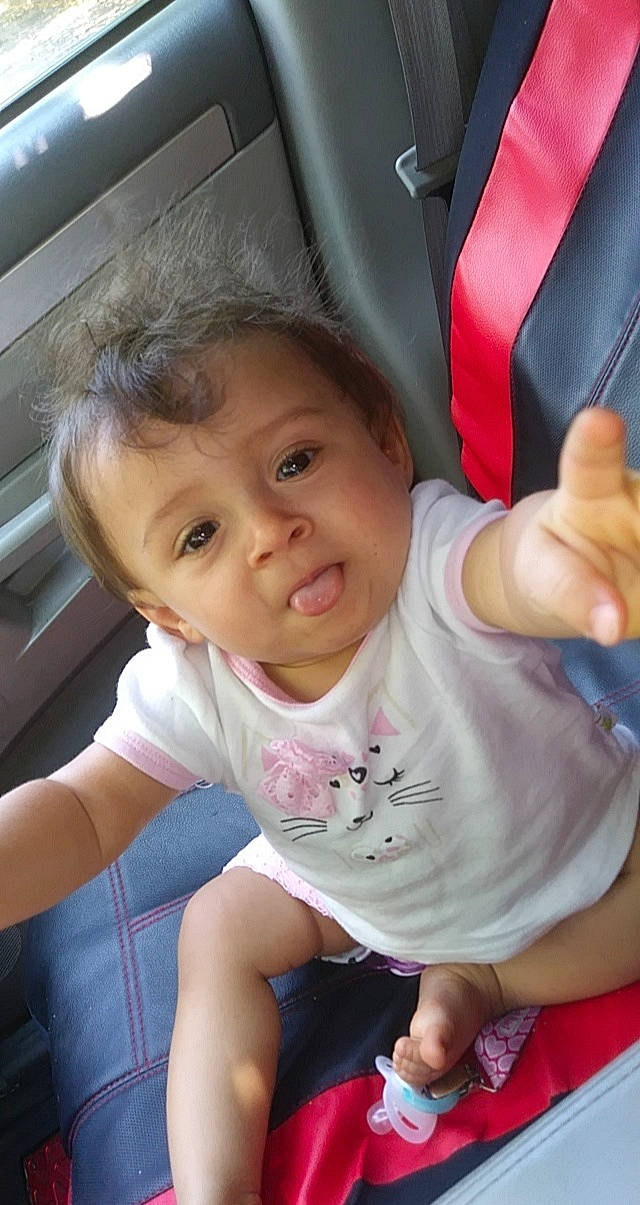 Mae'Leigh joined the competition — help win amazing prizes! baby, cheek, child, finger, gesture, hand, person, sitting, skin, smile, thumb, toddler