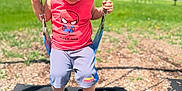 Kyrie joined the competition — help win amazing prizes! child, toddler, swing, playground, outdoor, grass, blue_sky, clouds, curly_hair, red_shirt, shorts, black_shoes, chains, sunny_day, smiling, holding, park, recreation, casual_clothing, happy