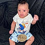 Kyrie joined the competition — help win amazing prizes! baby, infant, three_months, dinosaur, tshirt, shorts, black_background, sitting, cute, child, portrait, indoors, clothing, smiling, fist, feet, legs, person, young, curious
