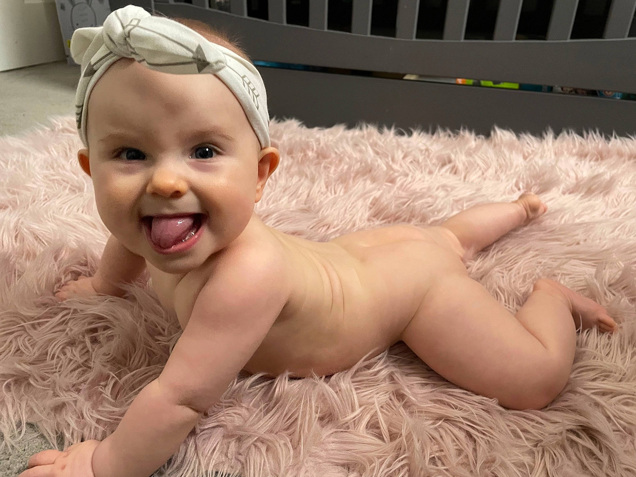 Fiona is registered to the contest to win money with this photo: baby, baby_laughing, barechested, bathing, blond, chest, child, comfort, face, fun, grass, happy, headgear, headpiece, iris, person, pink, skin, smile, swimming_pool