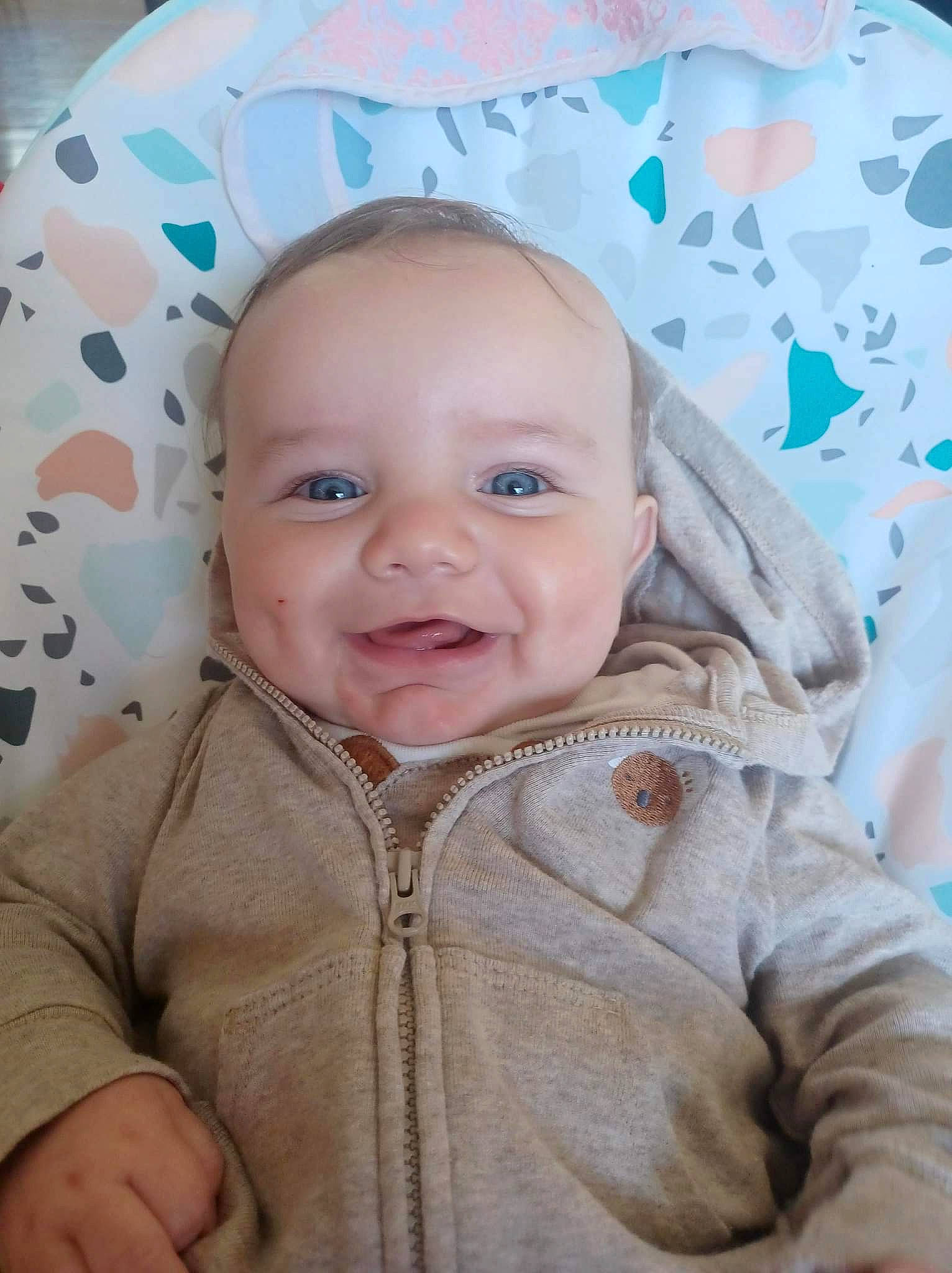 Corey is registered to the contest to win money with this photo: baby, cheek, chin, comfort, eye, eyebrow, face, happy, head, iris, joy, mouth, nose, organ, outerwear, person, photograph, product, skin, sleeve