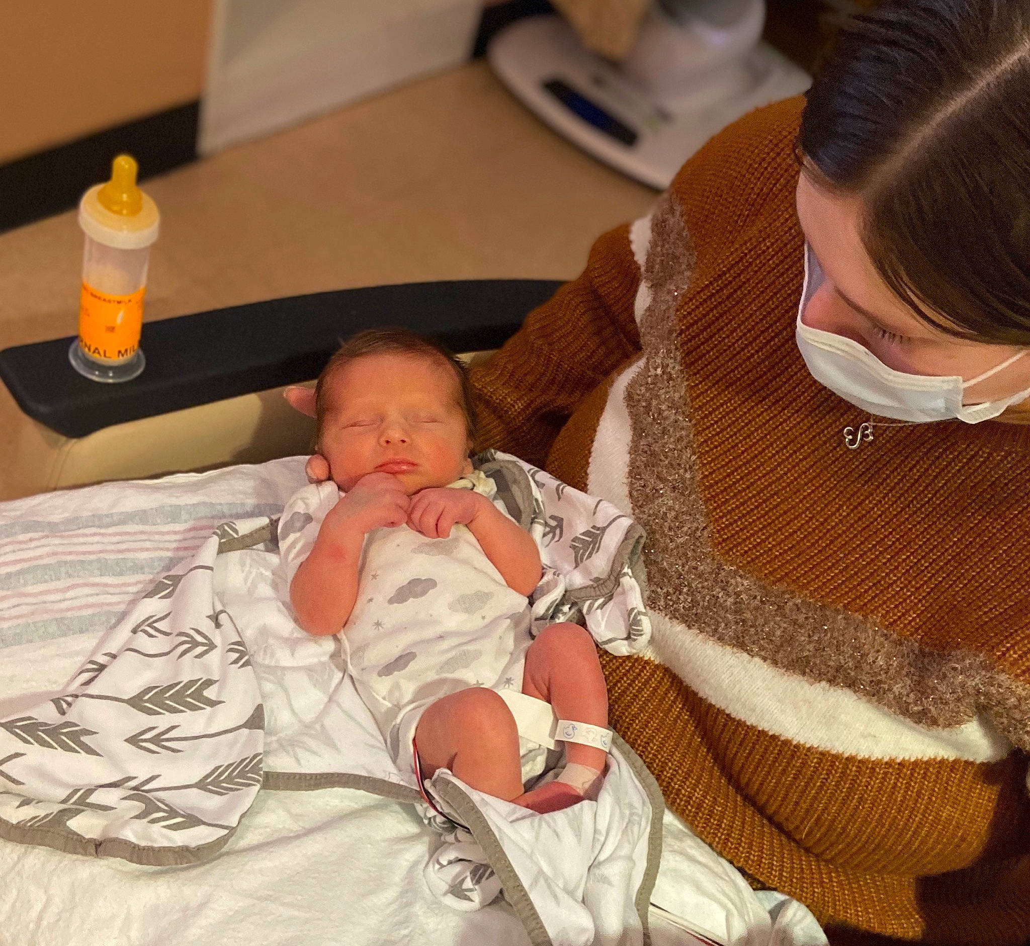 Cason is registered to the contest to win money with this photo: abdomen, baby, baby_products, baby_toddler_clothing, bottle, child, comfort, event, hat, health_care, hospital, hospital_bed, medical_procedure, patient, pattern, person, product, room, service, sleeve