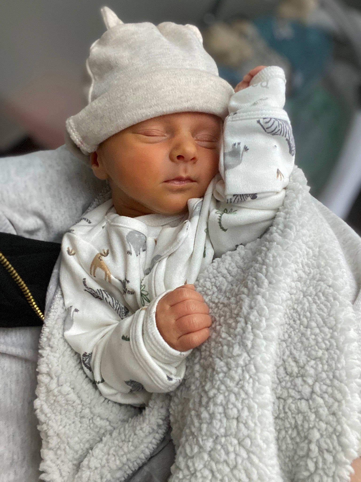 Cason is registered to the contest to win money with this photo: baby, cap, cheek, child, gesture, grey, happy, headgear, headwear, hood, human, knit_cap, outerwear, person, skin, sleeve, textile, toddler, white, winter