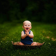 Roczen is registered to the contest to win money with this photo: baby, basket, child, childhood, clapping, cute, daylight, grass, greenery, happy, infant, nature, one_person, outdoor, people, playful, portrait, sitting, smiling, summer