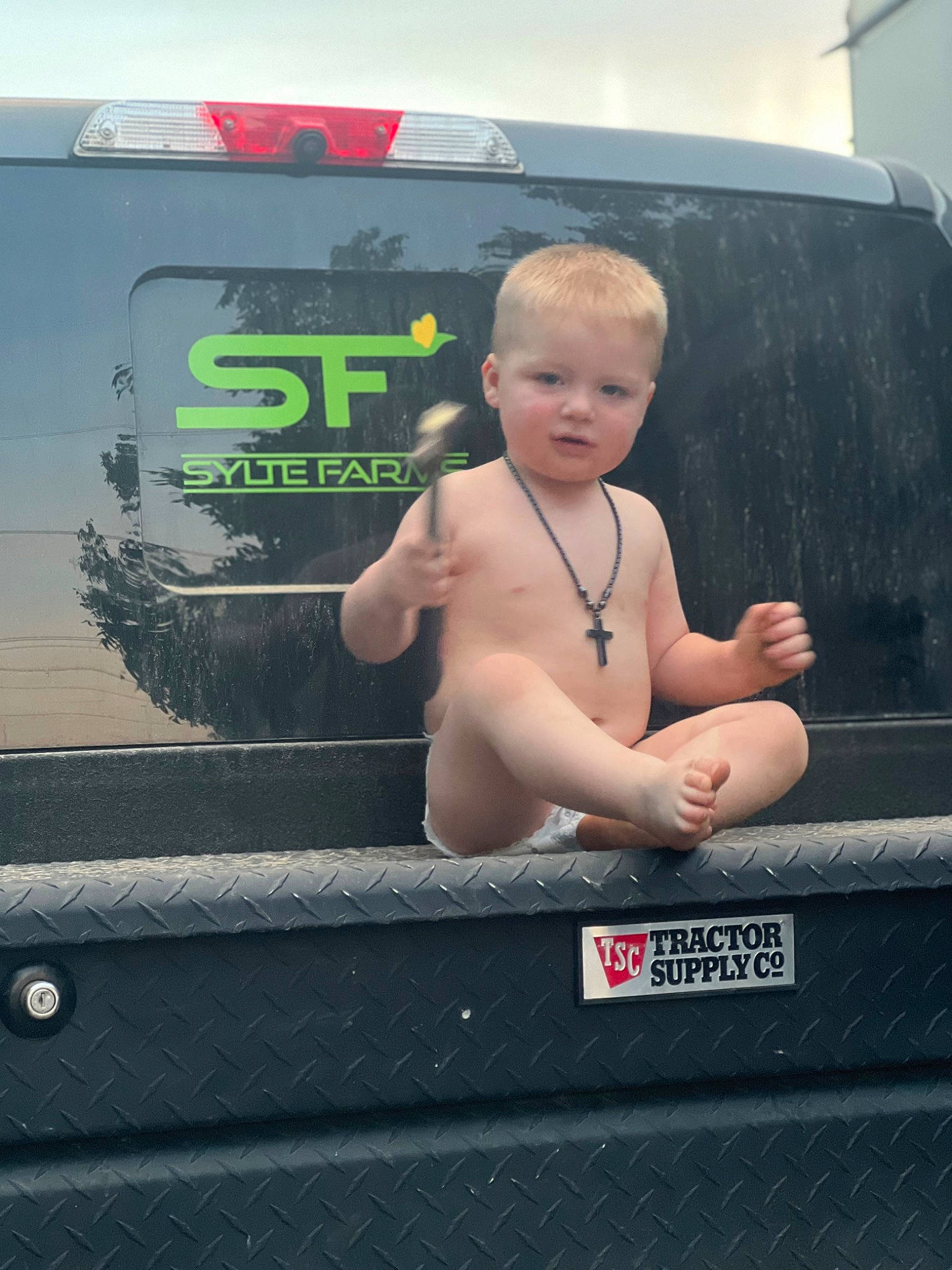 Greyson Level joined the competition — help win amazing prizes! auto_part, automotive_design, automotive_exterior, automotive_lighting, automotive_mirror, automotive_tire, automotive_window_part, bumper, chest, gas, grille, hand, hood, motor_vehicle, person, sky, toddler, vehicle_door, vehicle_registration_plate, windscreen_wiper