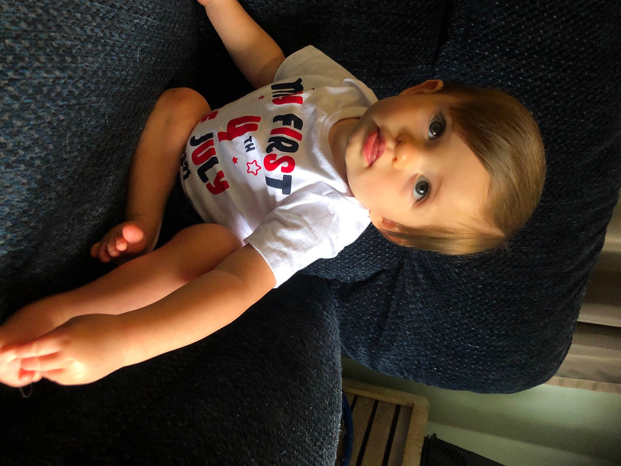 Kenny is registered to the contest to win money with this photo: baby, baby_toddler_clothing, chair, cheek, child, comfort, dress, elbow, finger, human_leg, joint, knee, lip, nail, person, sitting, skin, sleeve, thigh, toddler