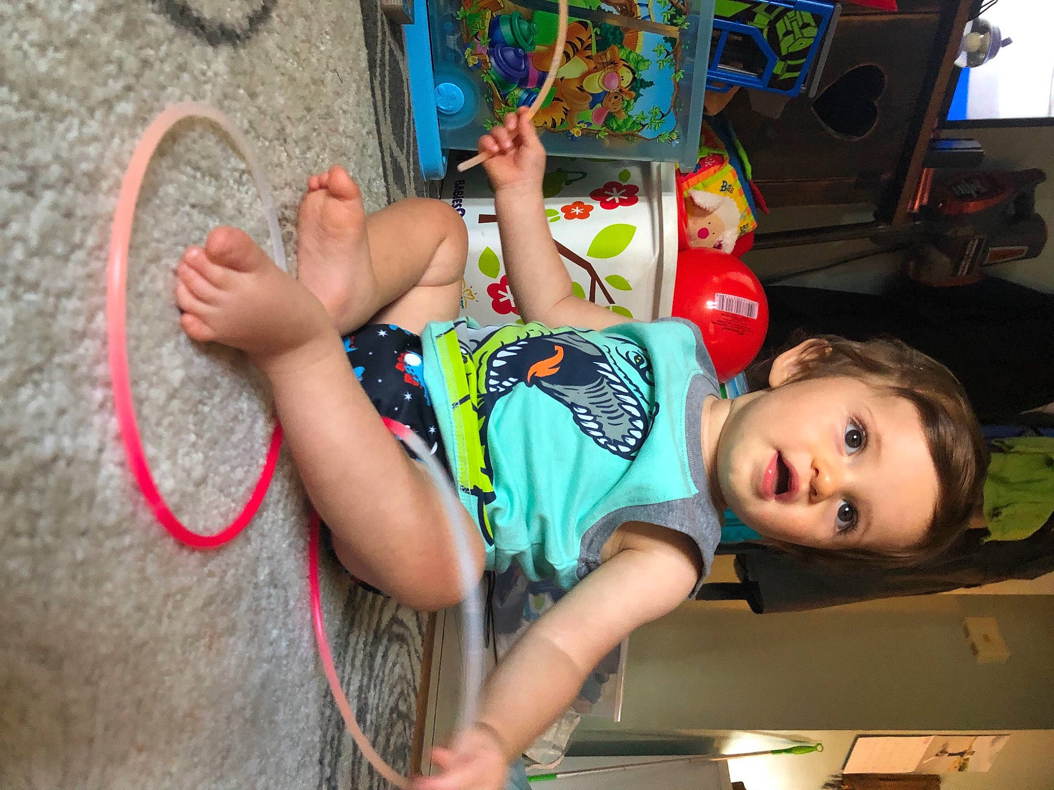 Kenny is registered to the contest to win money with this photo: baby, child, cool, fun, happy, leisure, people, person, play, recreation, sandal, shorts, summer, t_shirt, television, thigh, toddler, tree, vacation, vertebrate