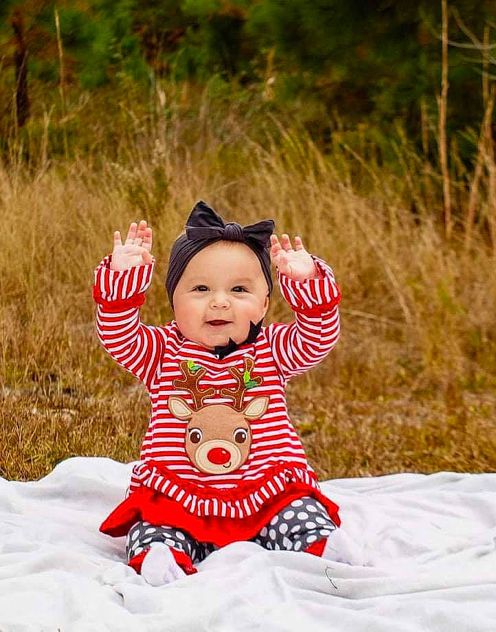 Paisley joined the competition — help win amazing prizes! baby, baby_toddler_clothing, child, costume_hat, fun, grass, happy, hat, headwear, leisure, magenta, pattern, people_in_nature, person, plant, recreation, sitting, sleeve, smile, sun_hat
