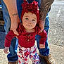 toddler, child, adult, hands, tattoo, red_headwrap, red_top, floral_pants, sandals, jeans, boots, outdoor, sidewalk, sunlight, person, portrait, cute, support, standing, casual