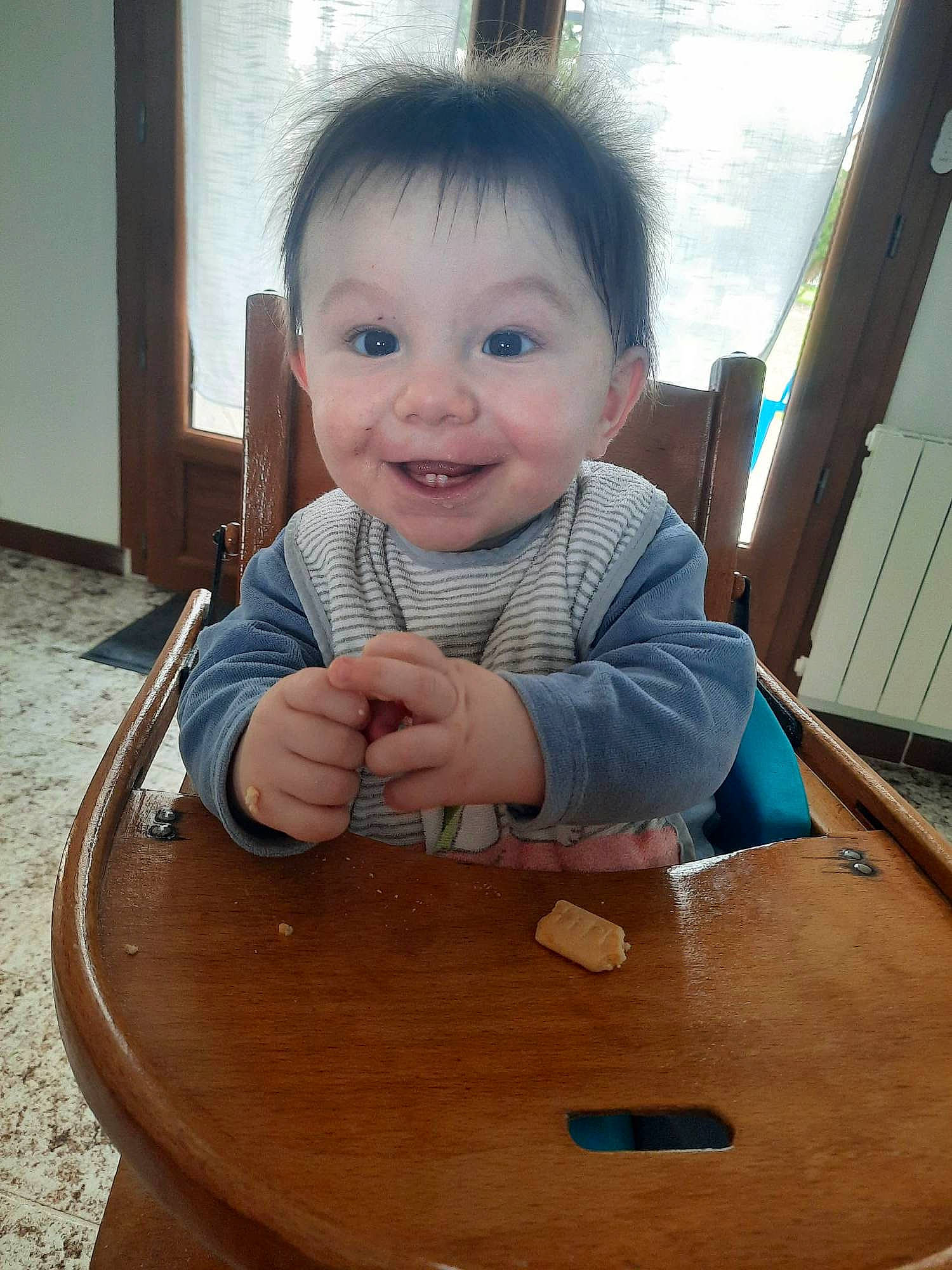 Lyron participe au concours pour gagner de l'argent avec cette photo : baby, baby_toddler_clothing, chair, cheek, child, flooring, fun, happy, hardwood, head, joy, person, product, skin, sleeve, smile, standing, table, toddler, varnish