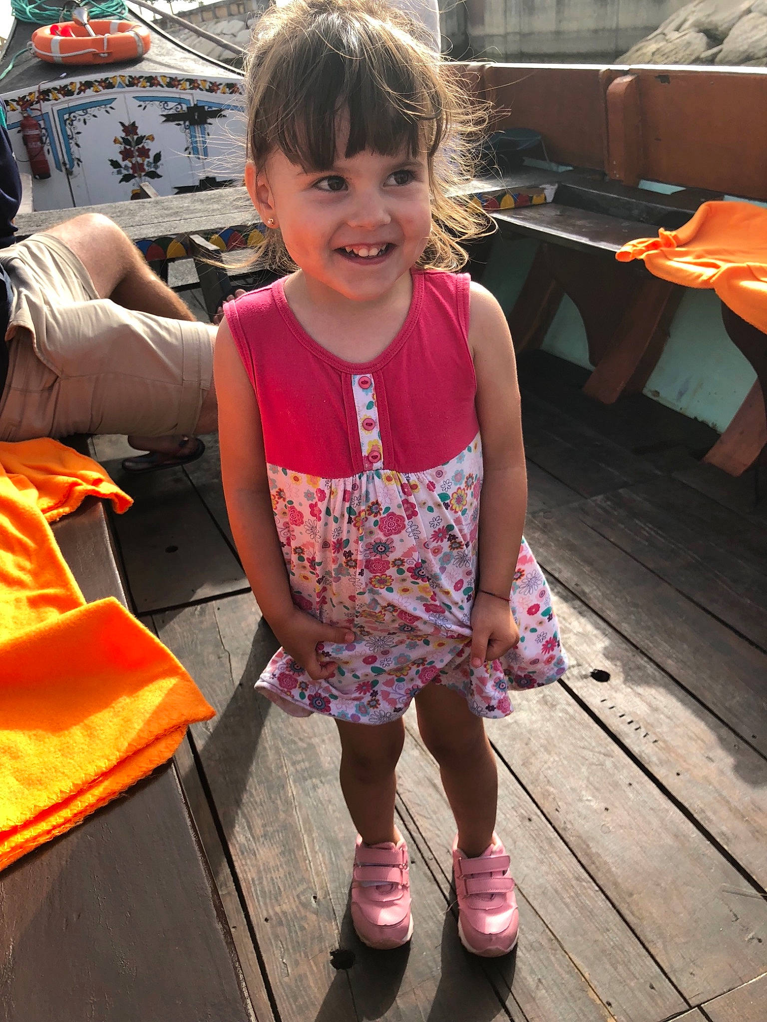 Cynthia participe au concours pour gagner de l'argent avec cette photo : child, day, footwear, fun, girl, joy, leg, person, pink, shoe, sitting, smile, standing, textile, toddler, vacation