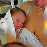Dallas is registered to the contest to win money with this photo: baby, newborn, hospital, infant, blanket, person, face, skin, bed, mother, medical, resting, sleeping, closeup, hospital_bed, human, healthcare, patient, comfort, parent