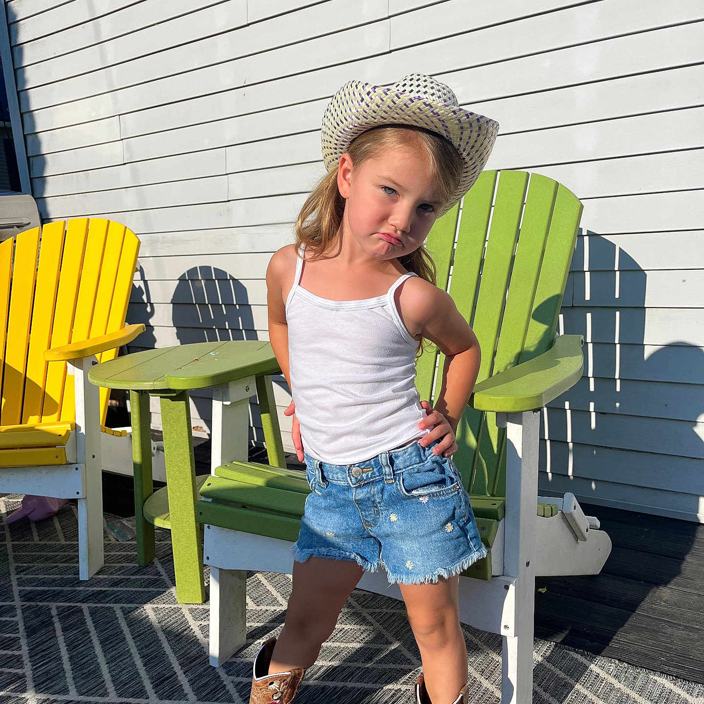 Piper joined the competition — help win amazing prizes! chair, child, clothing, desk, face, female, footwear, furniture, girl, hat, head, jeans, pants, person, photography, portrait, shoe, shorts, sunhat, table