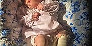 Alison joined the competition — help win amazing prizes! baby, sleeping, quilt, floral_pattern, pink_dress, socks, infant, cozy, sunlight, peaceful, cute, child, soft_light, portrait, resting, small_hands, blanket, indoors, newborn, comfort