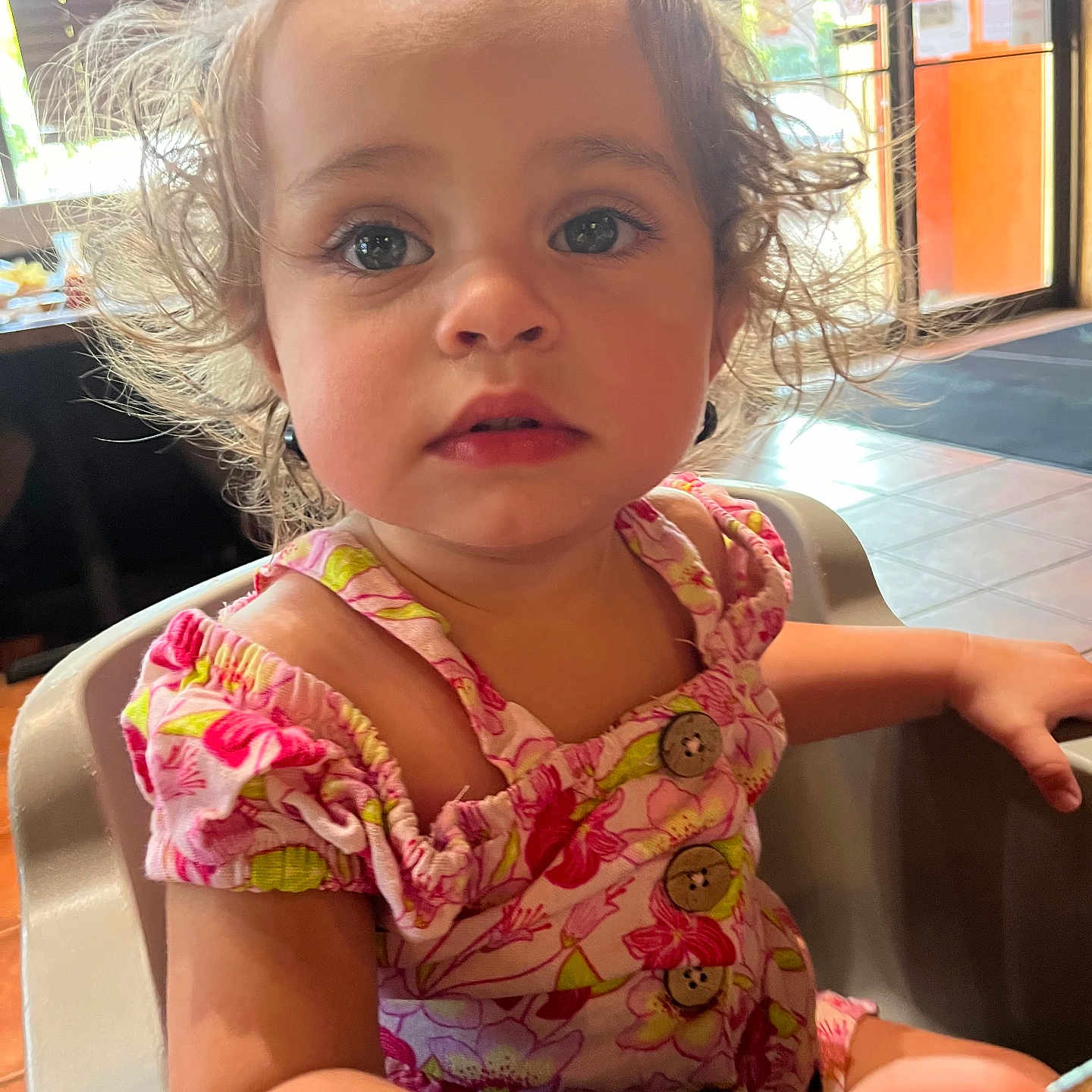 Chloe is registered to the contest to win money with this photo: blonde, bodypart, child, clothing, dress, face, female, finger, girl, hair, hand, happy, hardwood, head, indoors, person, photography, portrait, sitting, wood