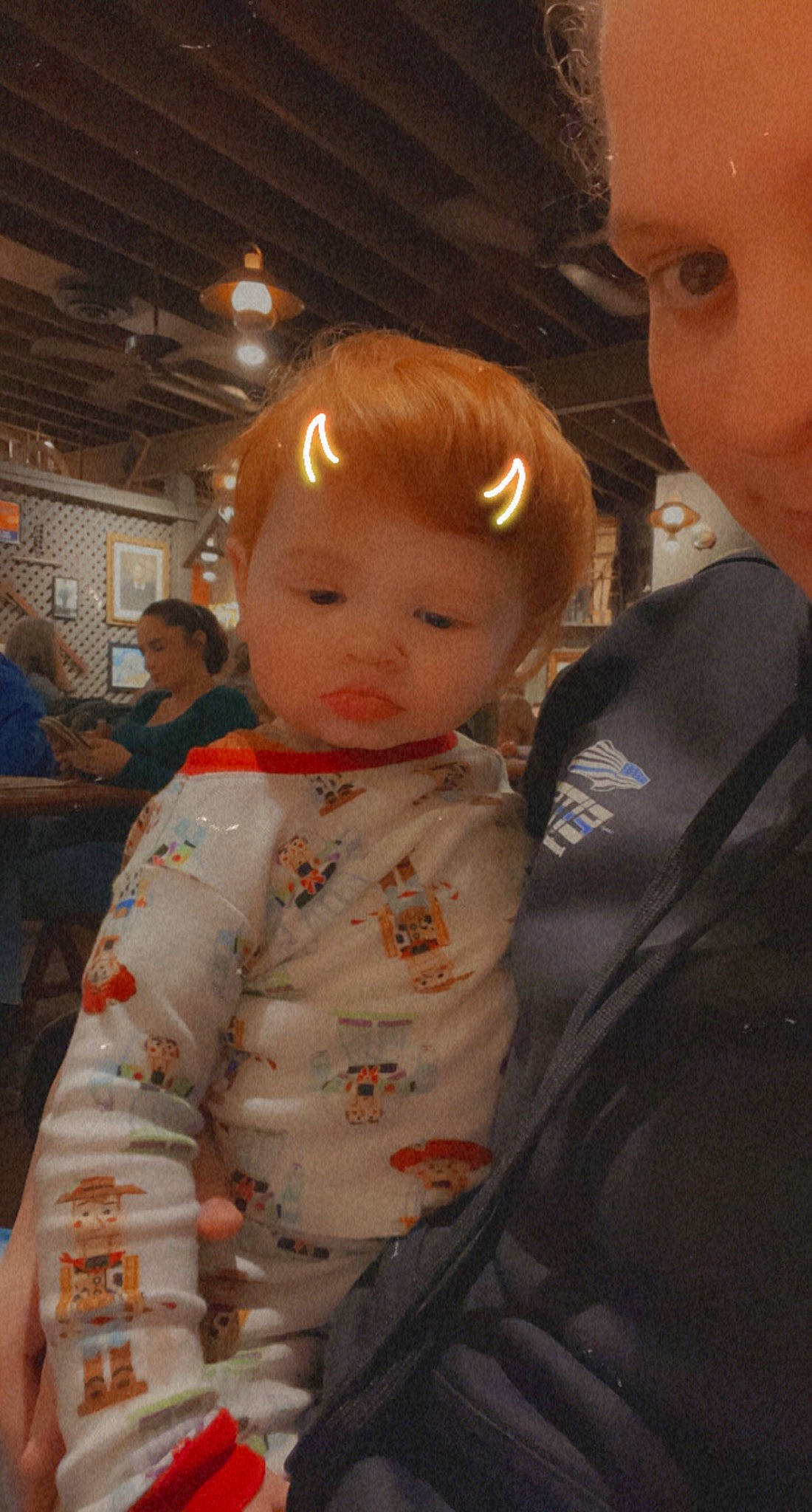 Asher is registered to the contest to win money with this photo: baby, baby_toddler_clothing, bib, chair, cheek, child, facial_expression, formal_wear, fun, happy, interaction, iris, person, sitting, skin, sleeve, toddler, vacation