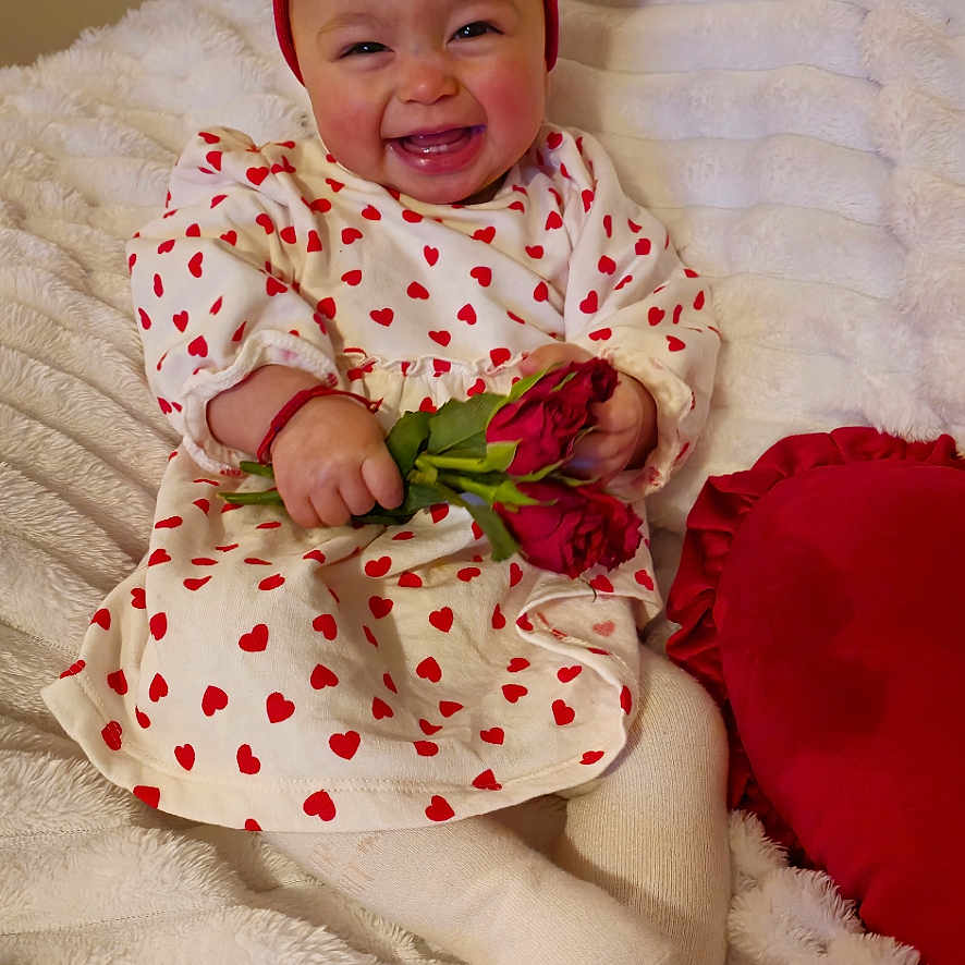 Mariela joined the competition — help win amazing prizes! baby, bodypart, clothing, couch, dress, face, finger, flower, flowerarrangement, flowerbouquet, hand, happy, hat, head, person, photography, plant, portrait, rose, smile