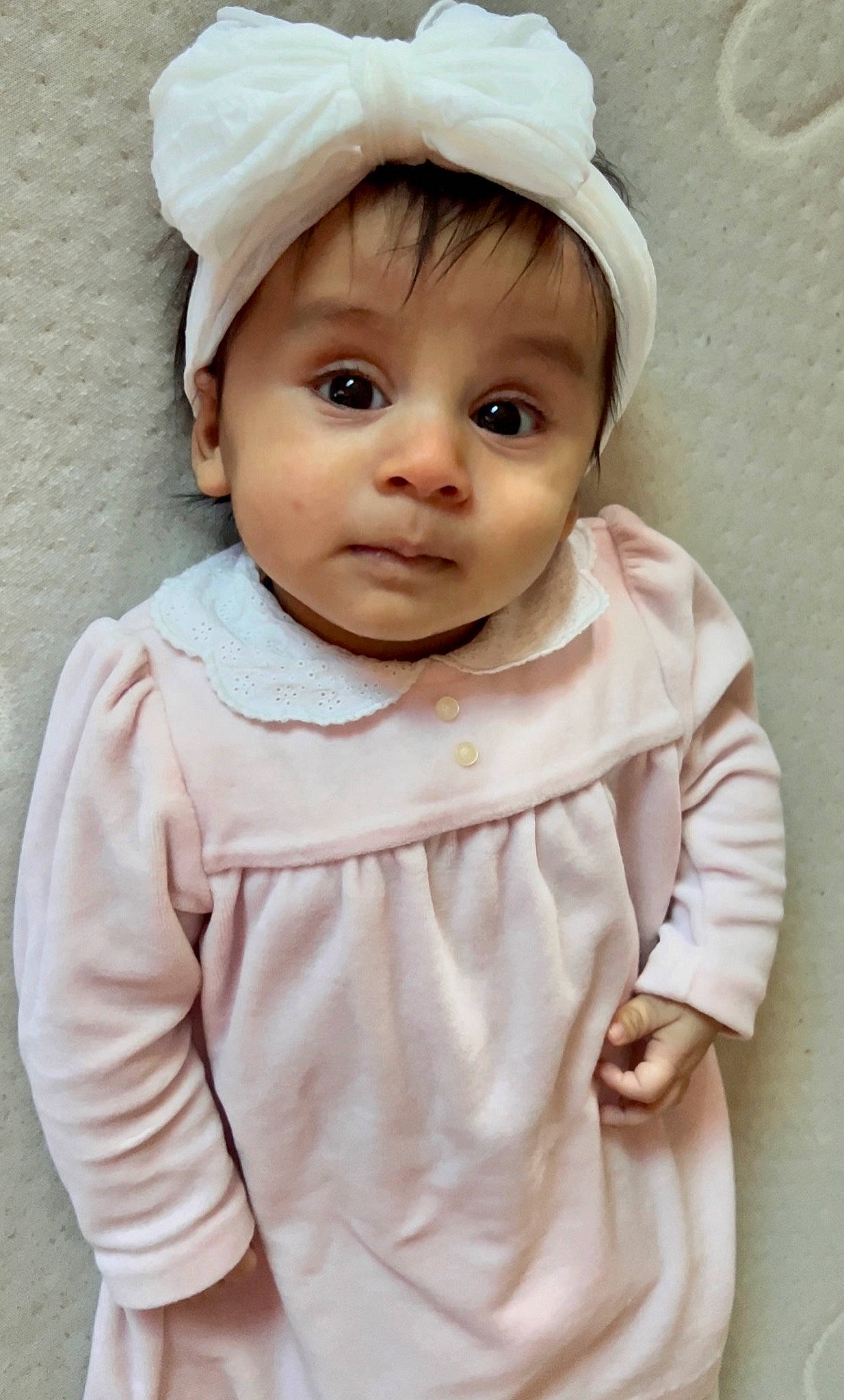 Amia is registered to the contest to win money with this photo: baby, baby_toddler_clothing, beauty, bonnet, cap, child, clothing, collar, embellishment, face, fashion_accessory, happy, outerwear, pattern, person, pink, portrait_photography, skin, sleeve, toddler